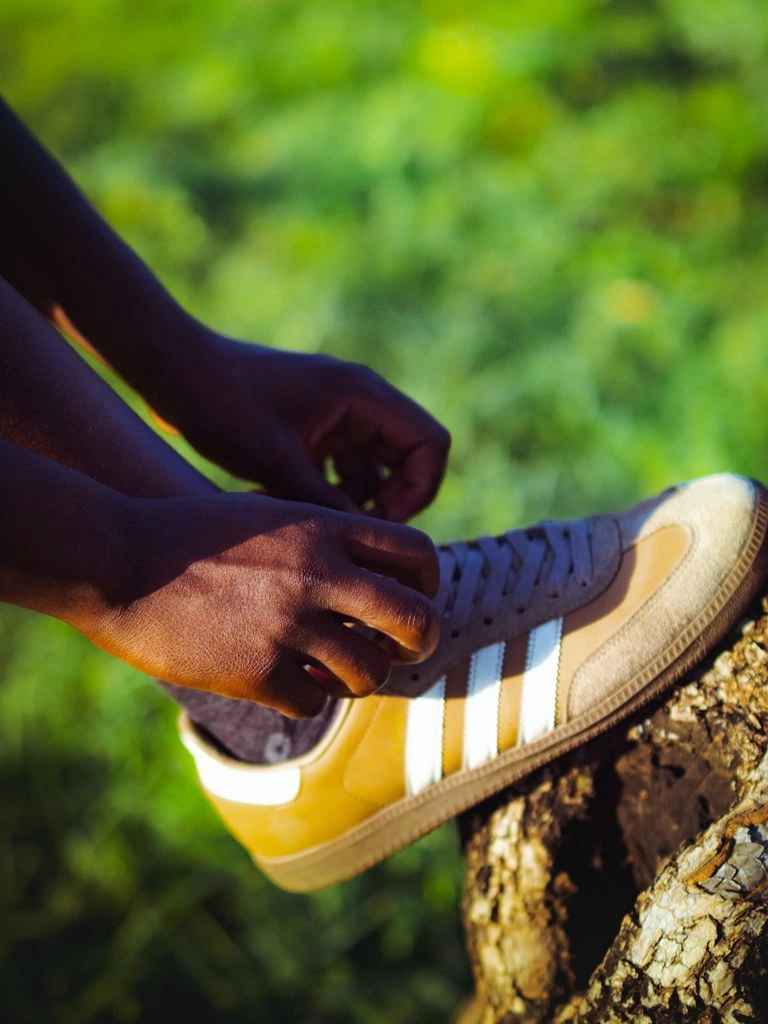 adidas Samba OG in cream and black, photographed on neutral paper